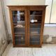 Glass-fronted walnut library 1900