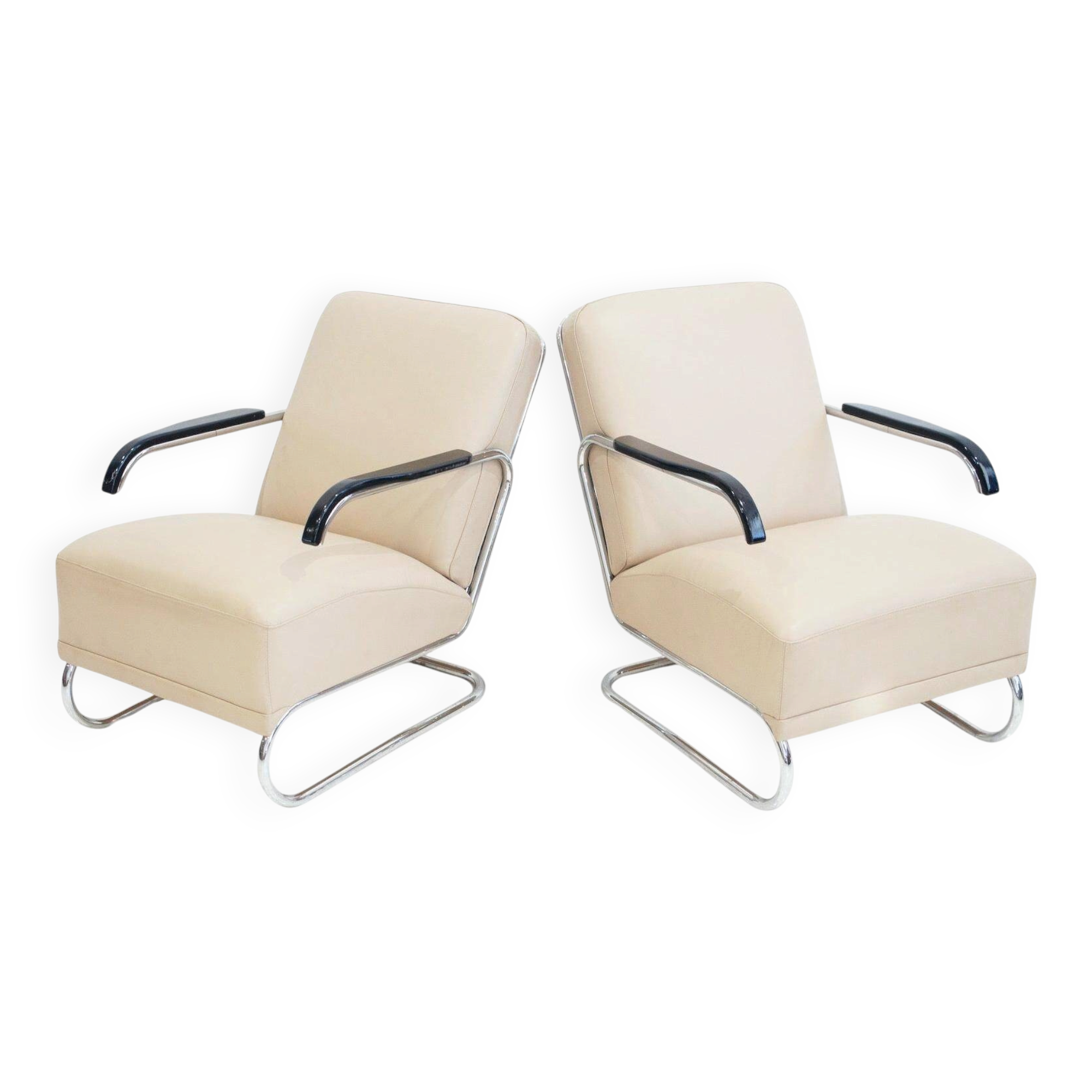 Pair of beige leather and tubular steel armchairs.