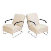 Pair of beige leather and tubular steel armchairs.