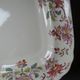 Antique Longchamp serving platter with polychrome daisies in ironstone.