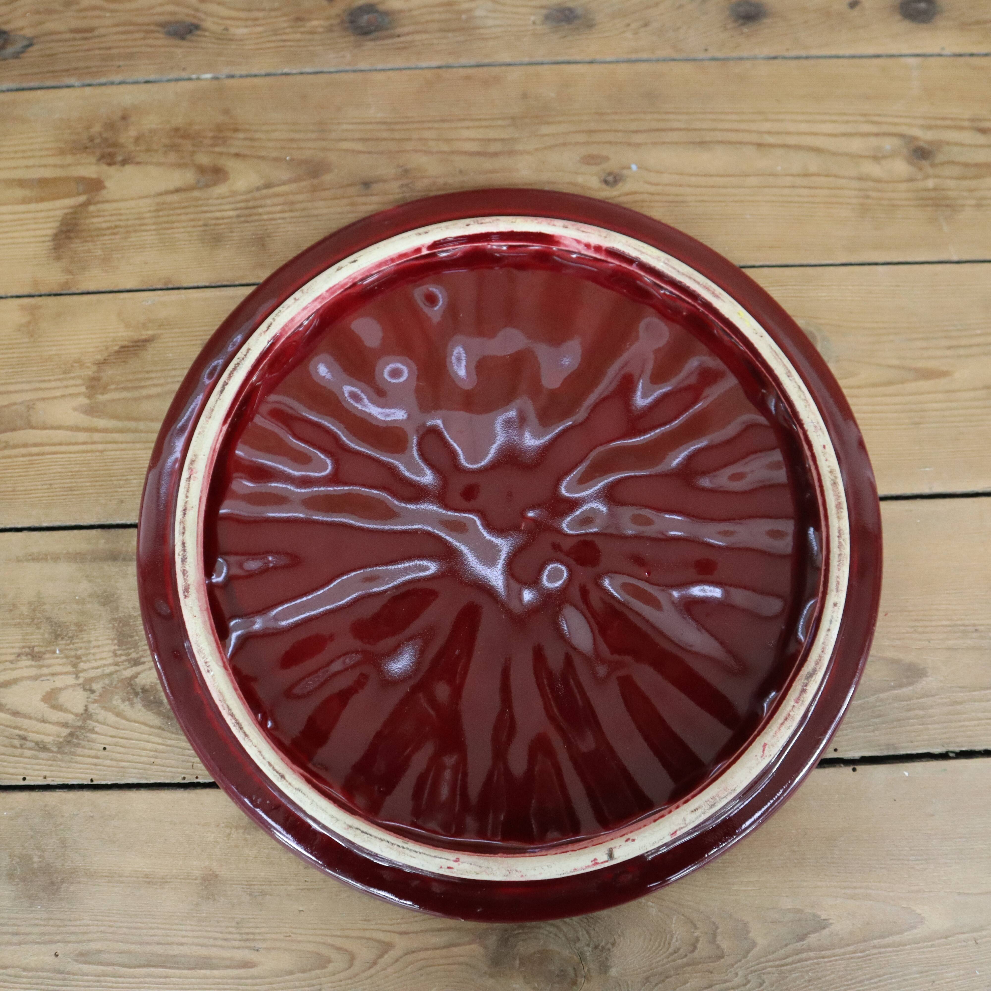 Burgundy slip tray and its small vintage knife from the 50s
