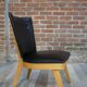 Cocktail armchair of the 50s in wood and black imitation