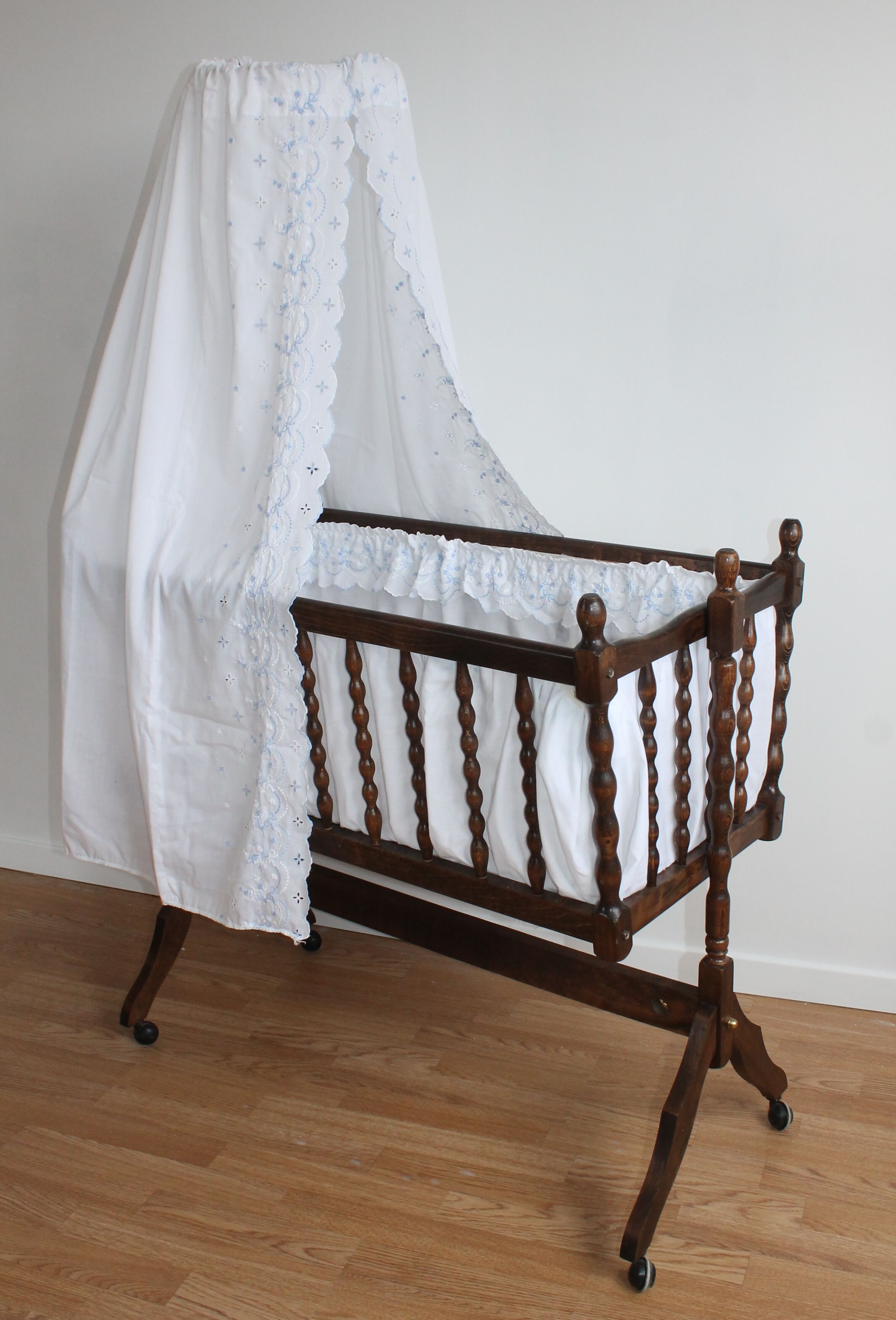 Old Vintage cradle with balance on wheels