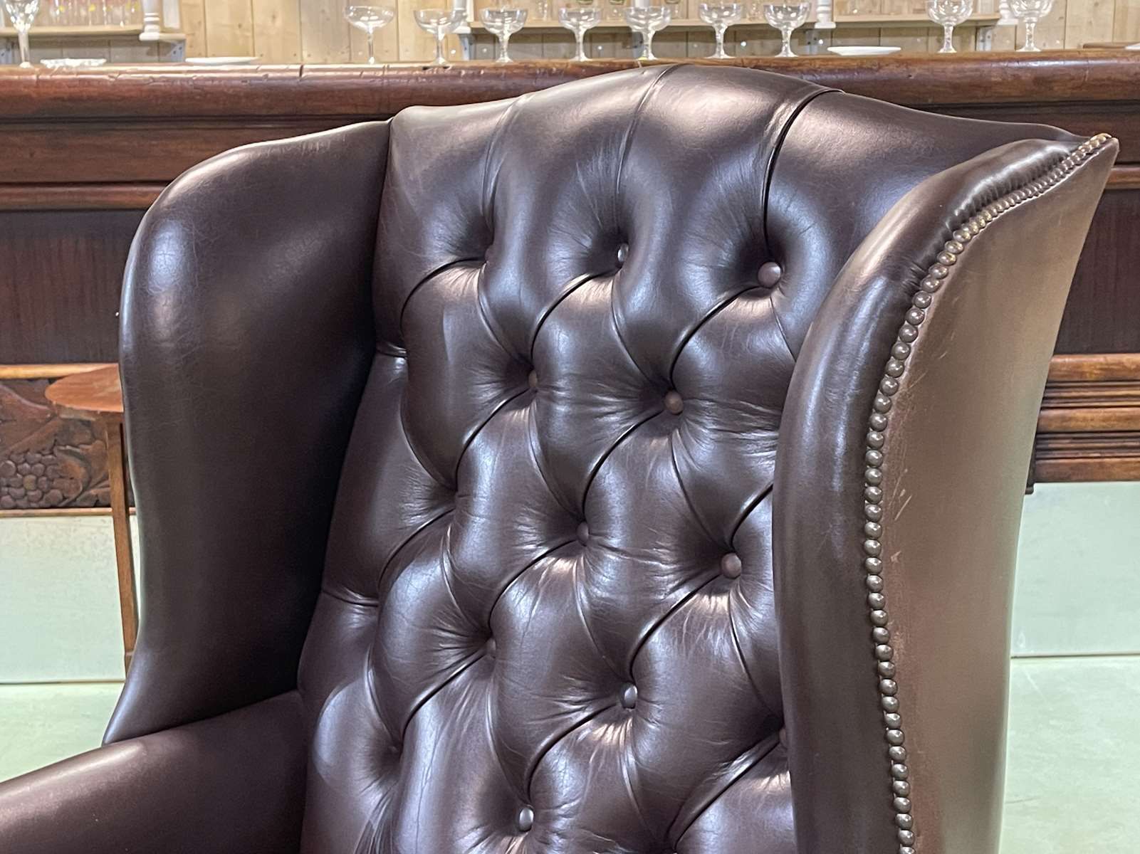 Chesterfield armchair with brown leather ears from the 1990s in very good condition
