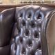Chesterfield armchair with brown leather ears from the 1990s in very good condition