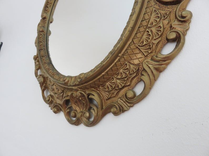 Golden baroque oval mirror, 60s-70s