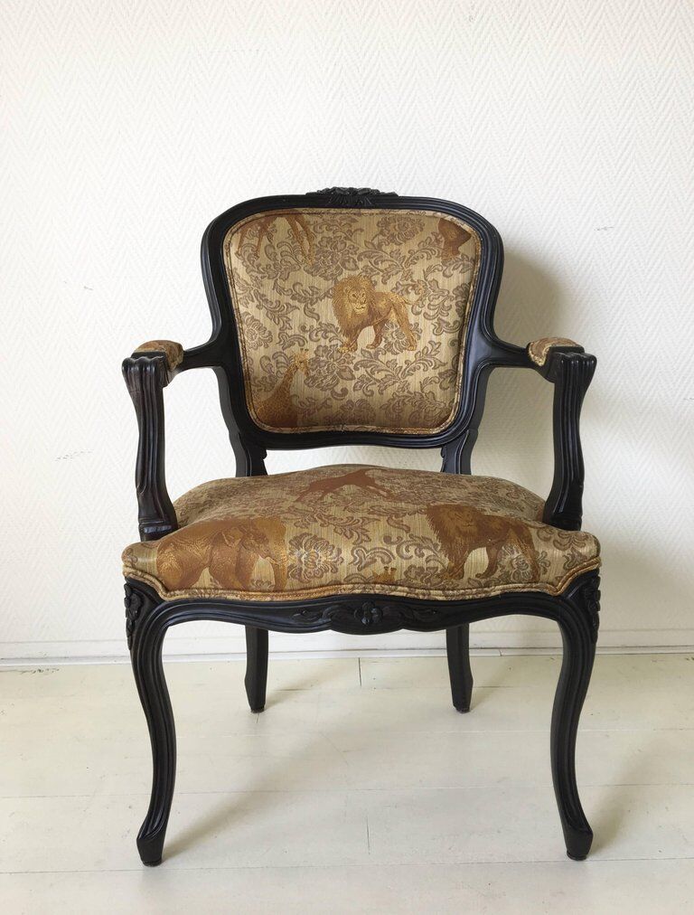 Black baroque armchair with fabric designed by wildlife by Ascension Latorre, Spain