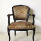 Black baroque armchair with fabric designed by wildlife by Ascension Latorre, Spain