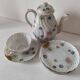 coffee pot, cup and saucers