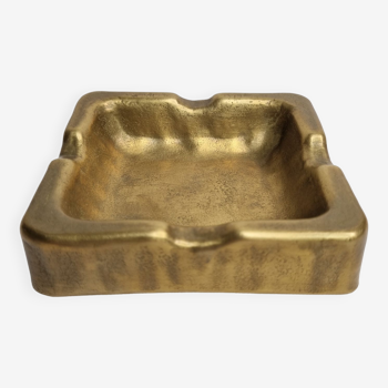 Empty pocket brutalist-inspired ashtray in gilded bronze