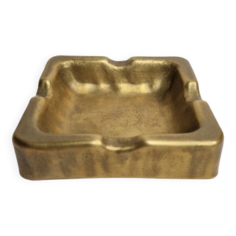 Empty pocket brutalist-inspired ashtray in gilded bronze