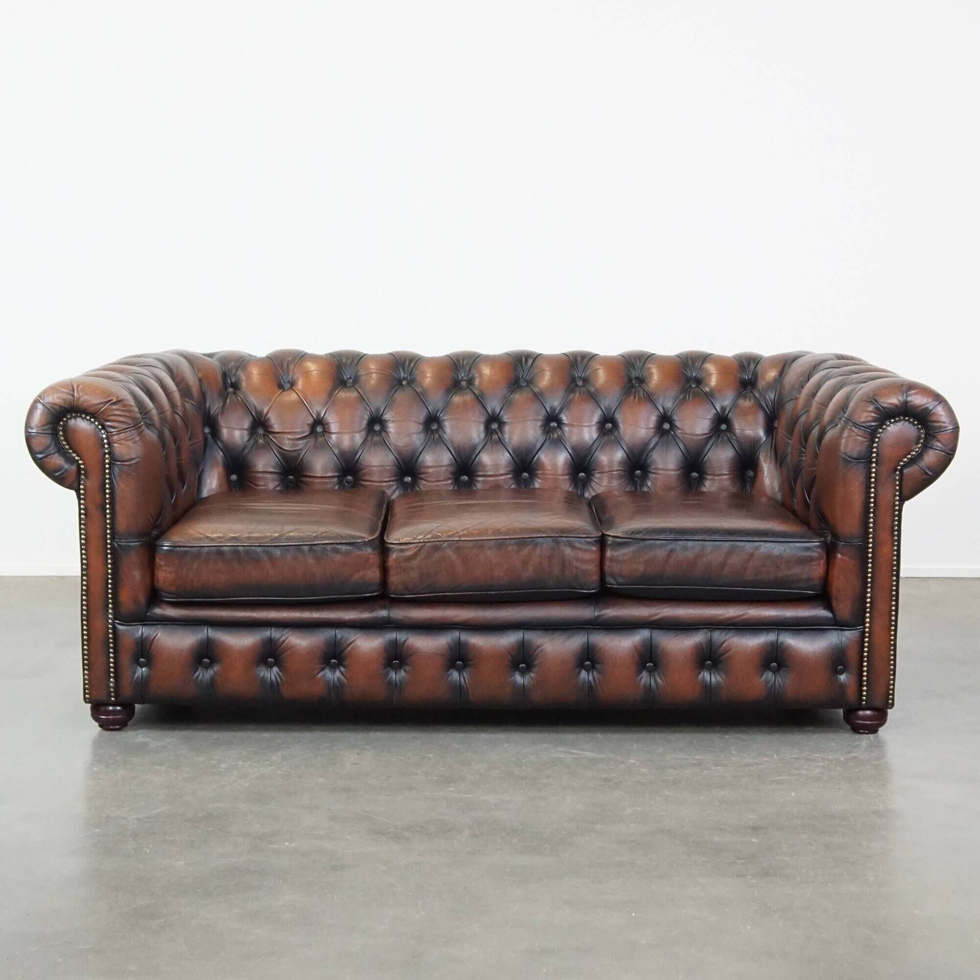 Classic English Chesterfield 2.5 seater sofa in brown cowhide