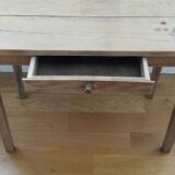 Small old wooden table with inclusion of coins and keys