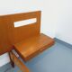 Double bed in vintage Scandinavian style from the 1960s with bedside tables.