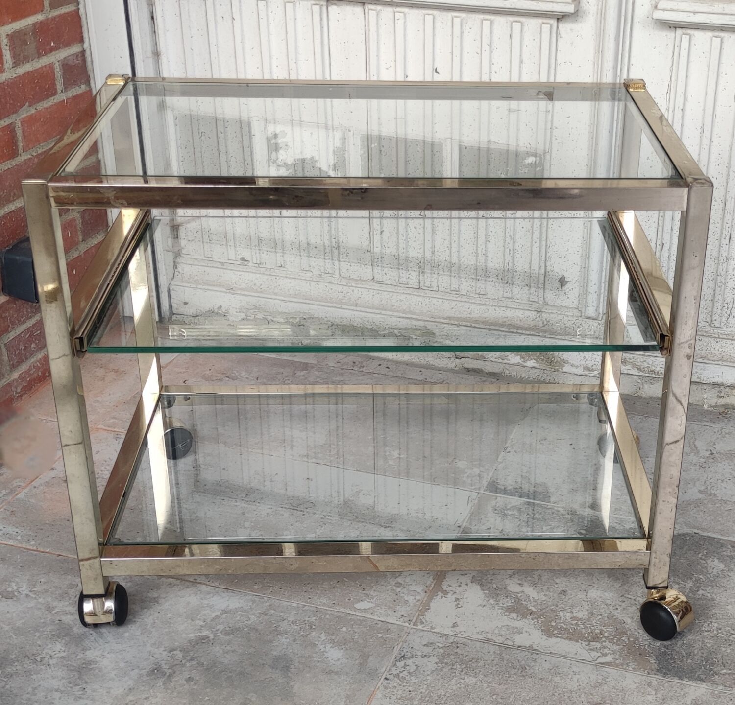 Rolling console service design / gold metal and glass