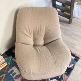 Vintage armchair reupholstered in boucle fabric.