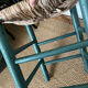 Vintage stool in green patinated wood and straw