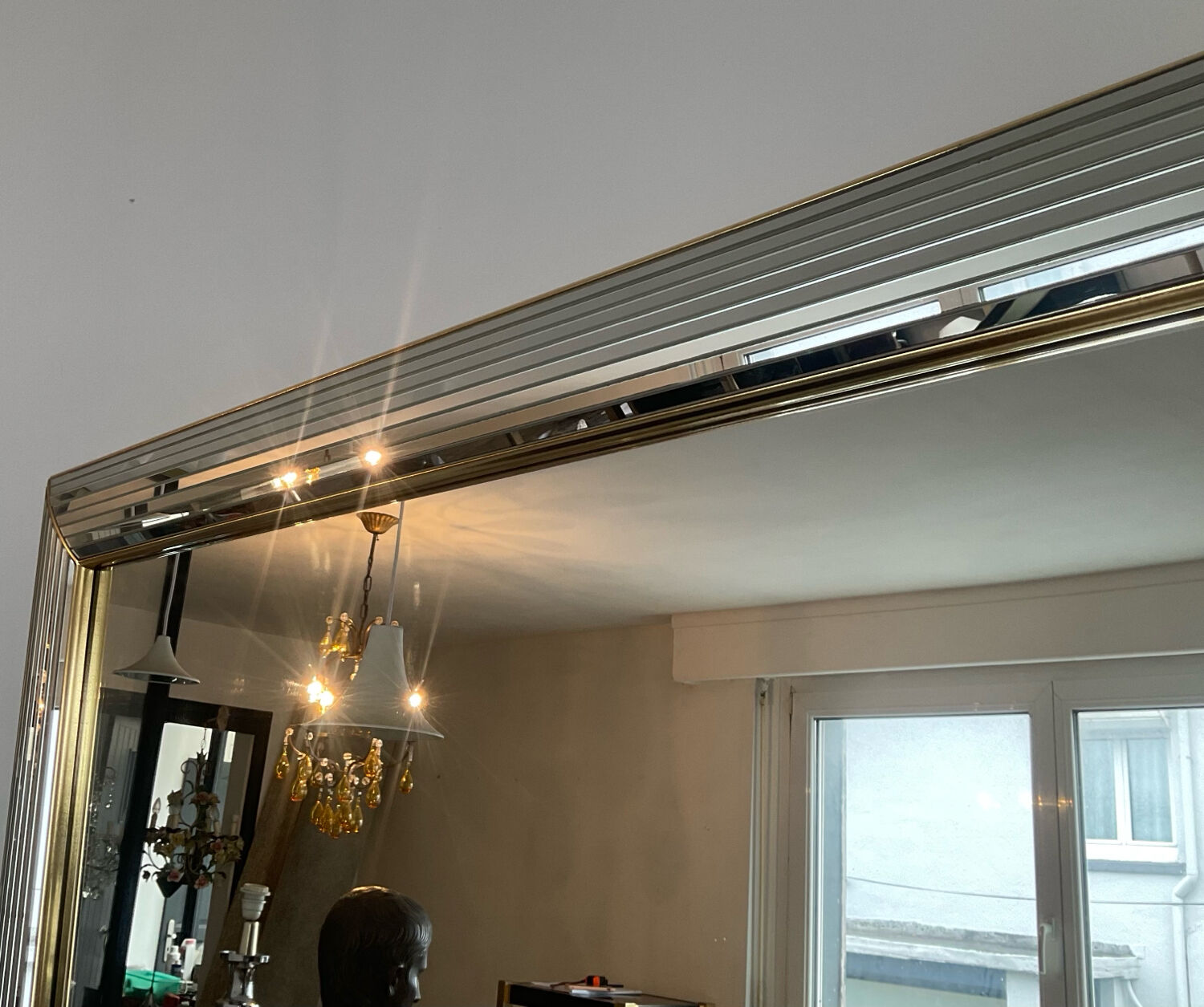 Large vintage Hollywood Regency style mirror with shutters.