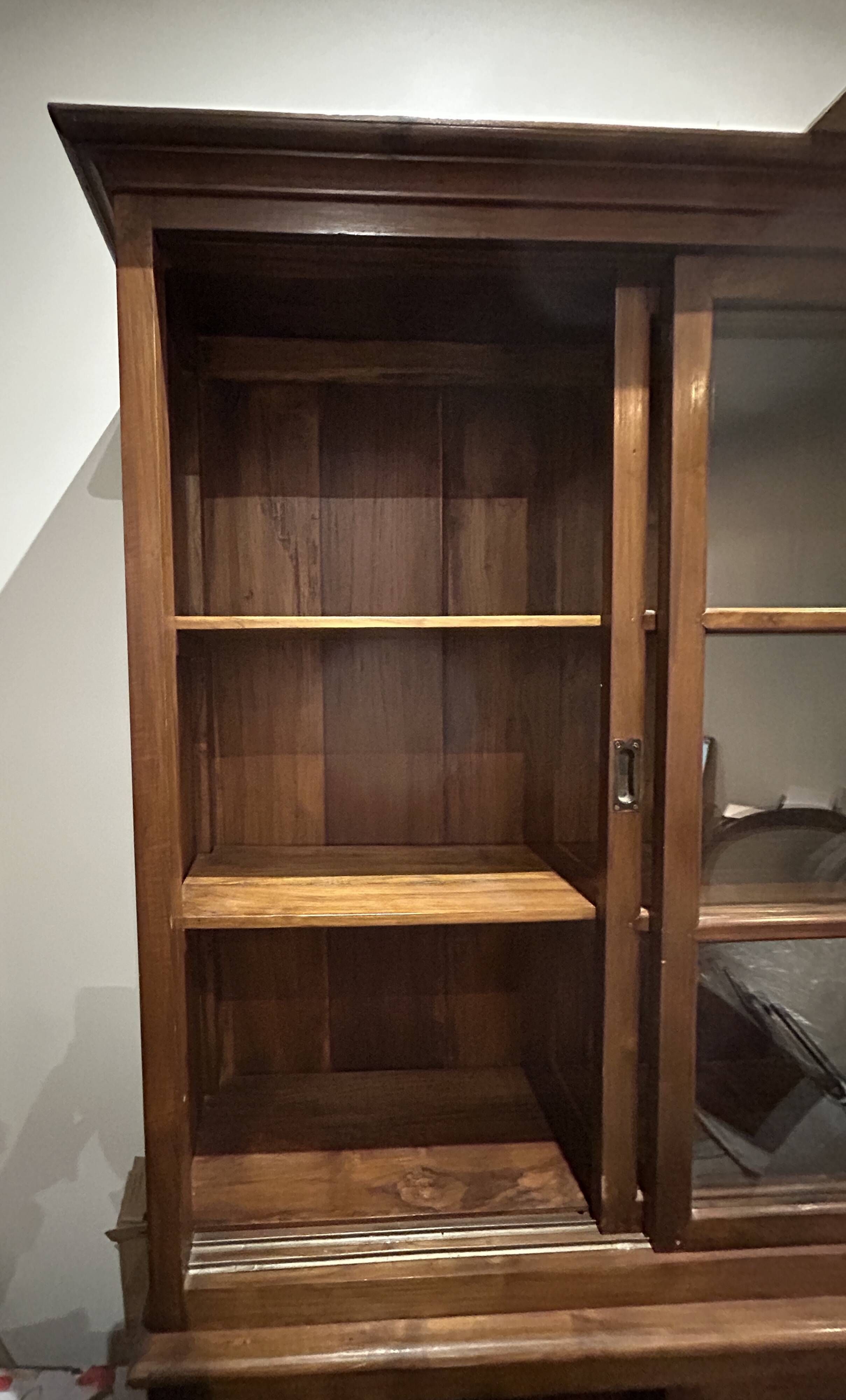 Large double-body showcase library in solid teak.