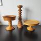 Vintage decor trio: candlestick and light wood bowls in Scandinavian style.