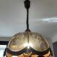 Scandinavian style glass and wood pendant light.