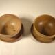 Two sandstone bowls and saucers