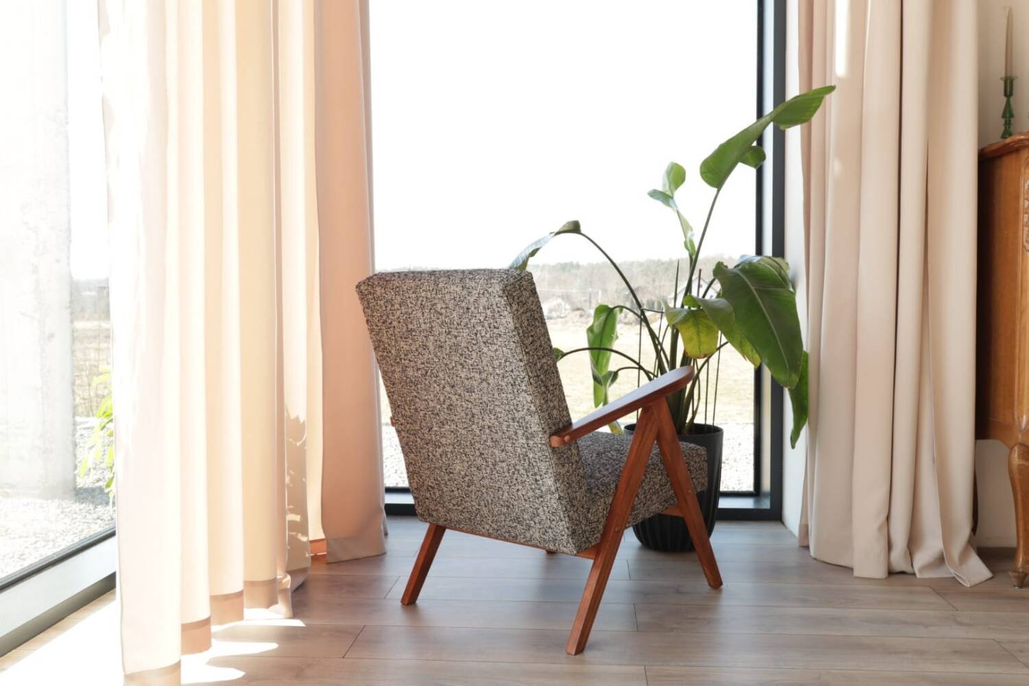 Vintage design armchair in mixed black fabric, walnut-coloured wood.
