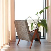 Vintage design armchair in mixed black fabric, walnut-coloured wood.