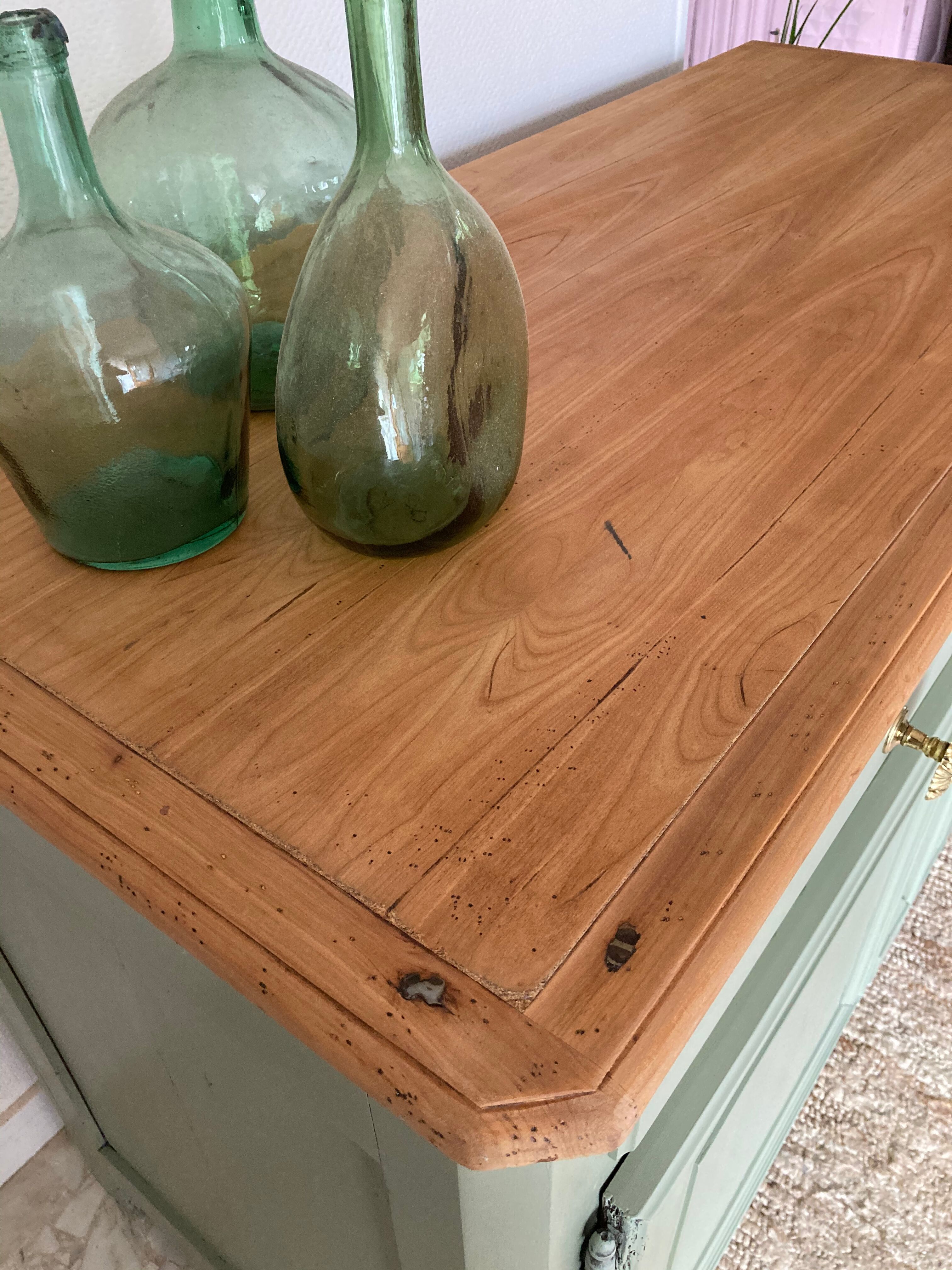 Pastel green low buffet, raw wood tray