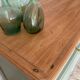 Pastel green low buffet, raw wood tray