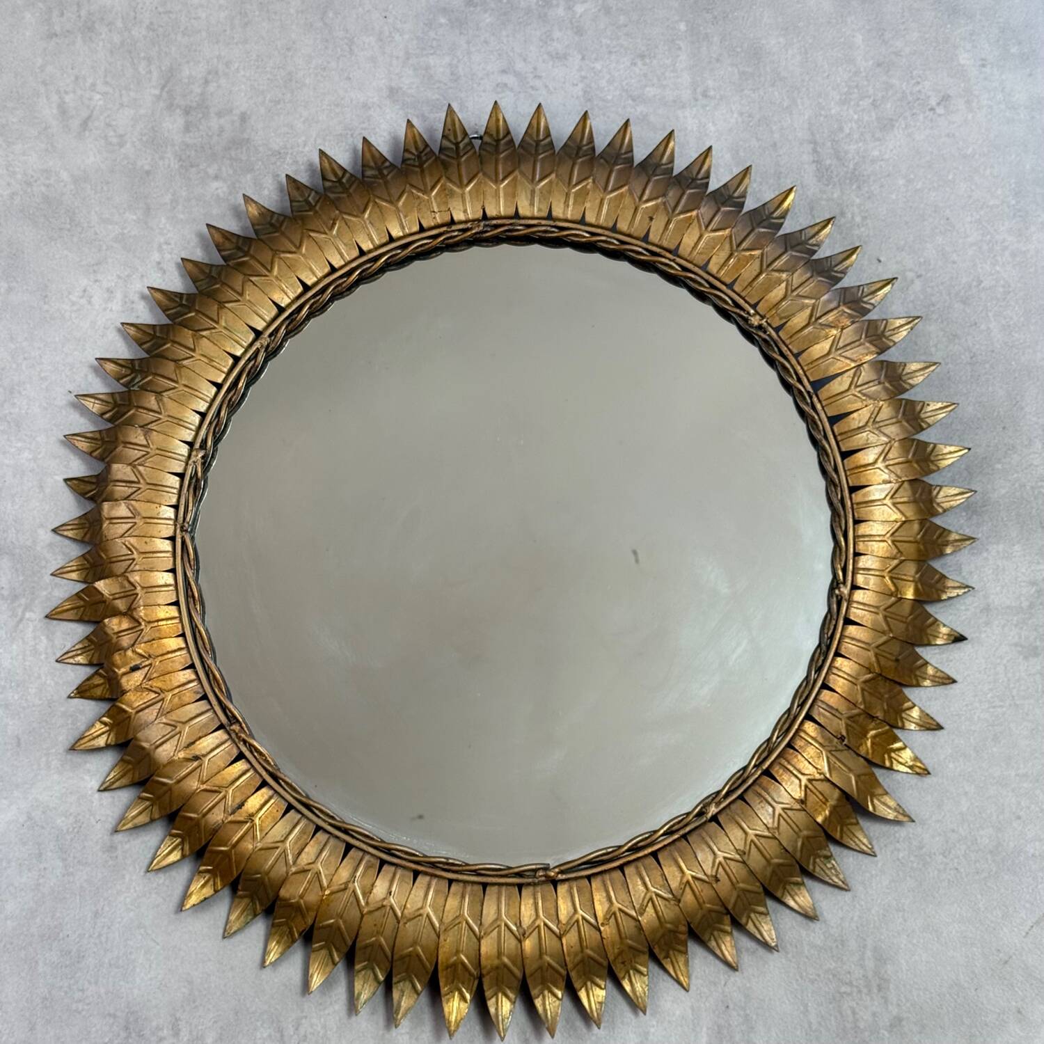 Round sun mirror in wrought iron from the 1950s Italy.