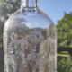 Two antique engraved glass bottles