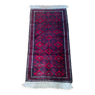 Handmade wool oriental rug from the 20th century