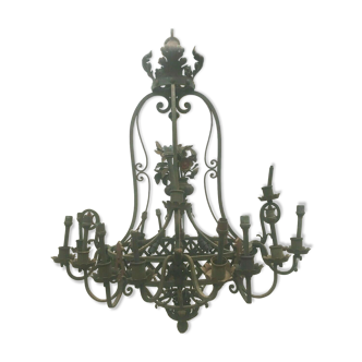 Hammered iron chandelier has twenty light arms XX century