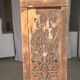 Rectangular Indonesian construction element with blue and yellow plant in carved wood