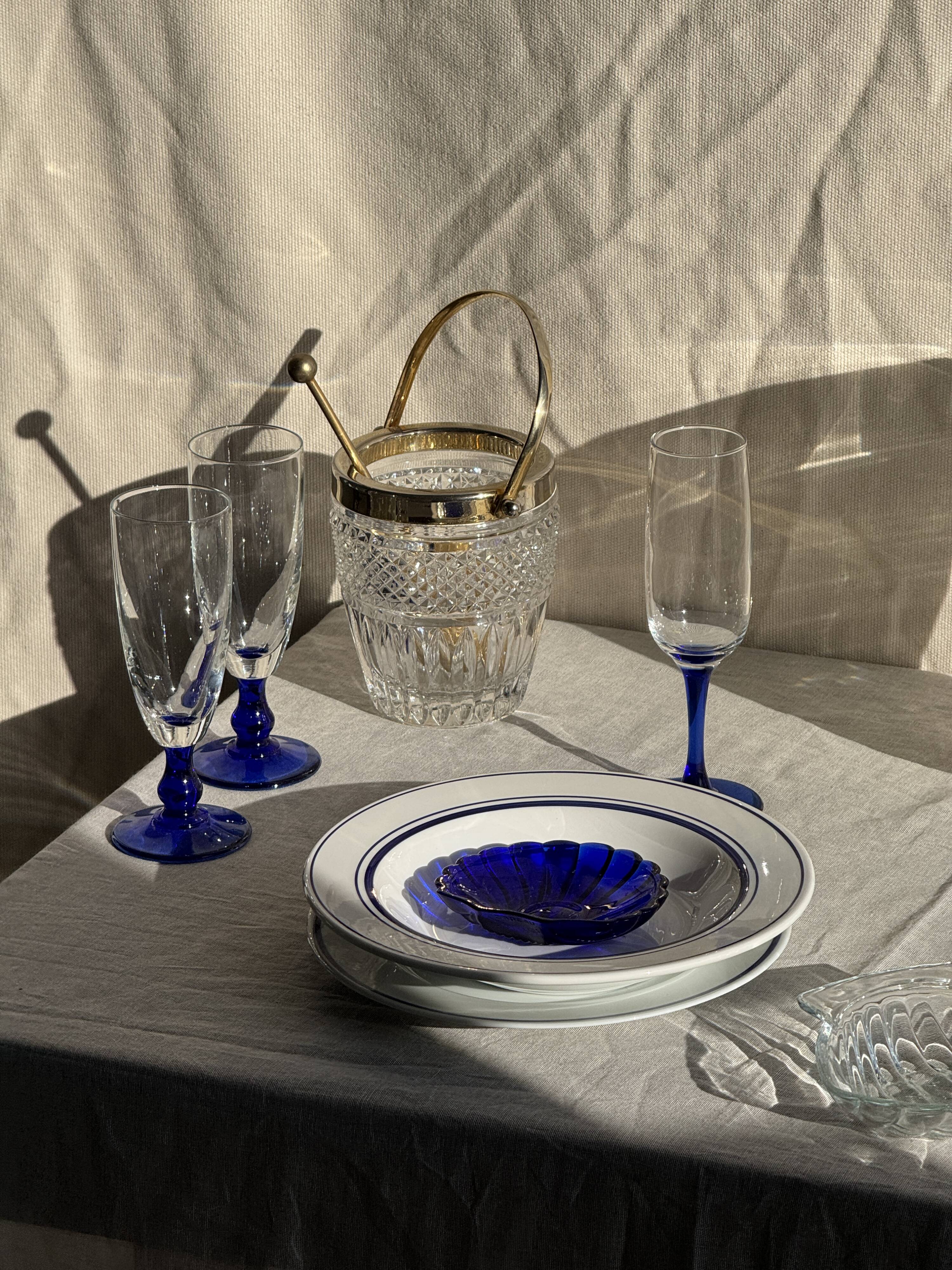Small golden glass ice bucket with diamond point design and its scoop.