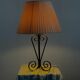 Vintage wrought iron table lamp in swirl shape with pleated shade