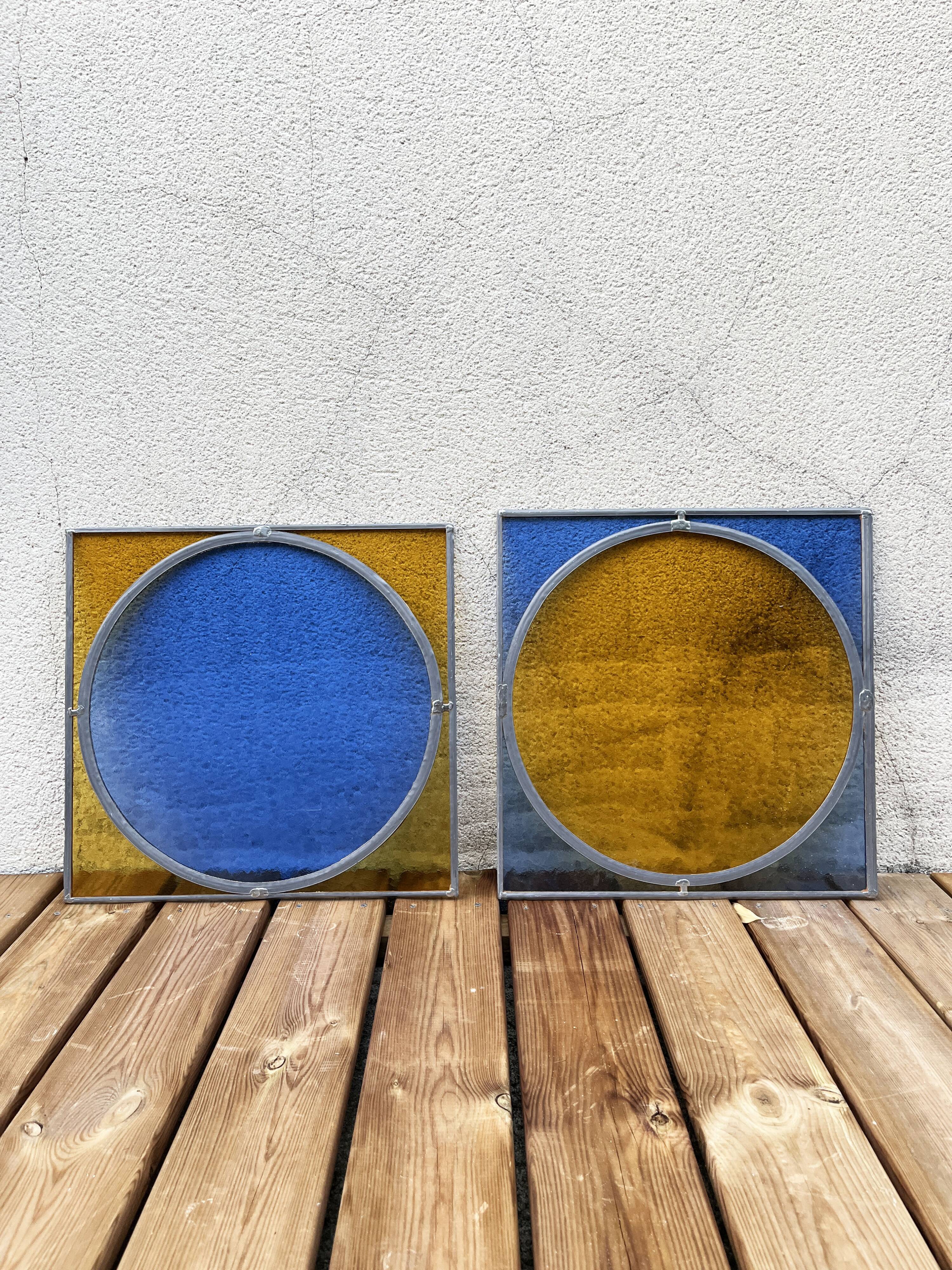 Pair of antique blue and yellow stained glass windows