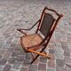 Bamboo folding chair and caning, leather and brass