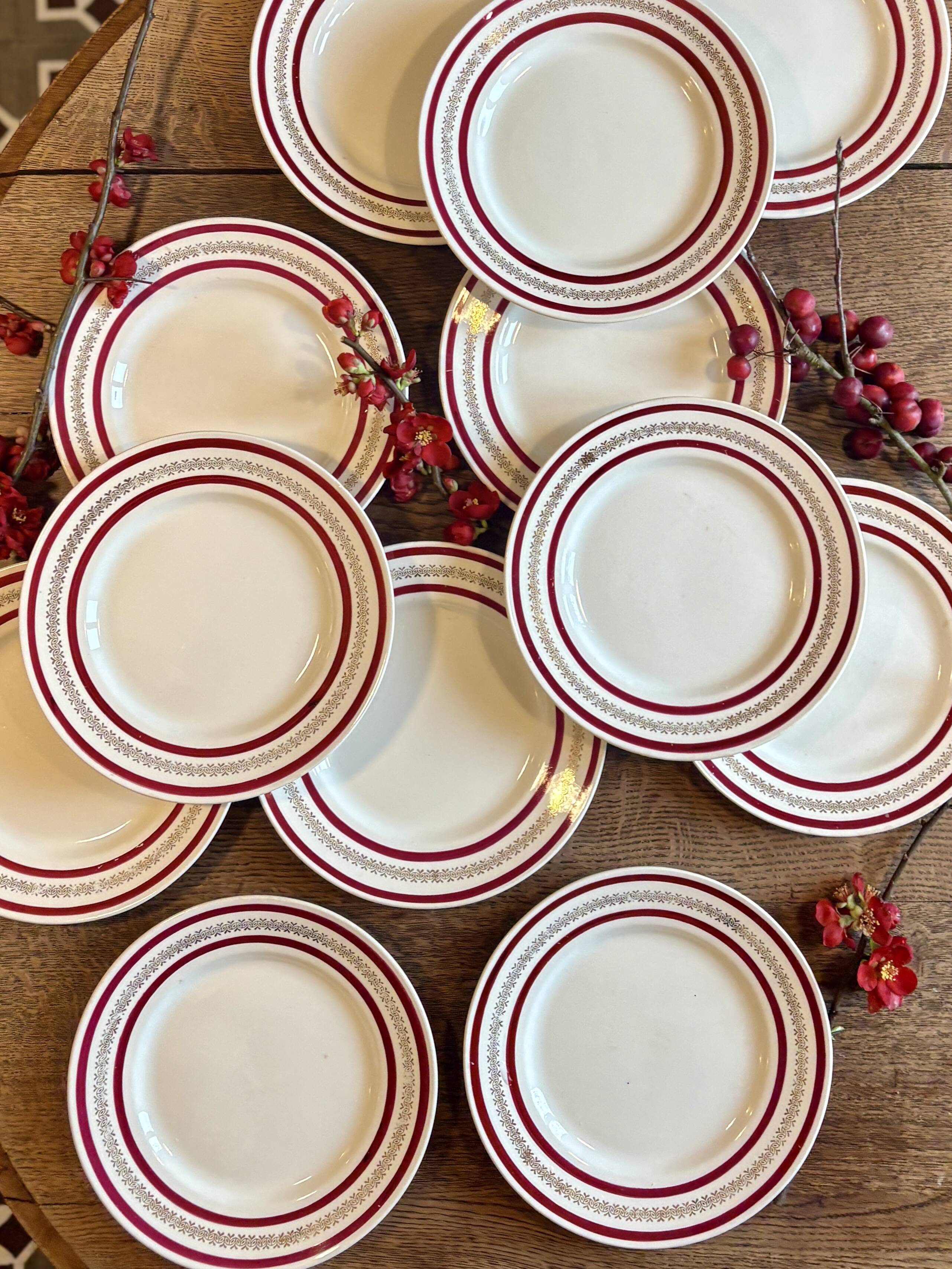 Set of 12 antique Gien red and gold dinner plates.