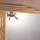 Antique Art Deco mercury mirror, in carved wood with gold leaf.