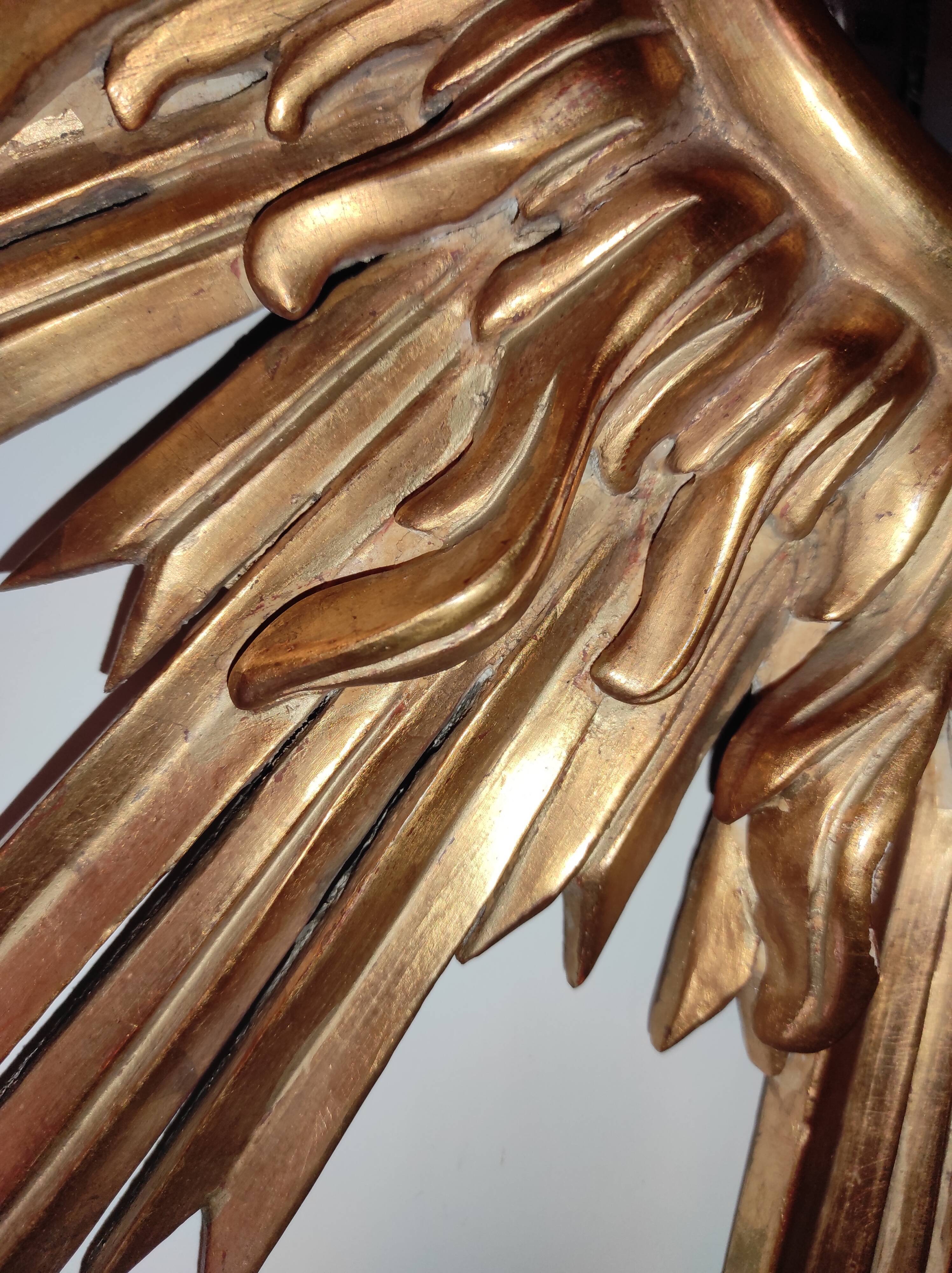 Sun mirror and witch's eye in gilded wood