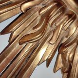 Sun mirror and witch's eye in gilded wood