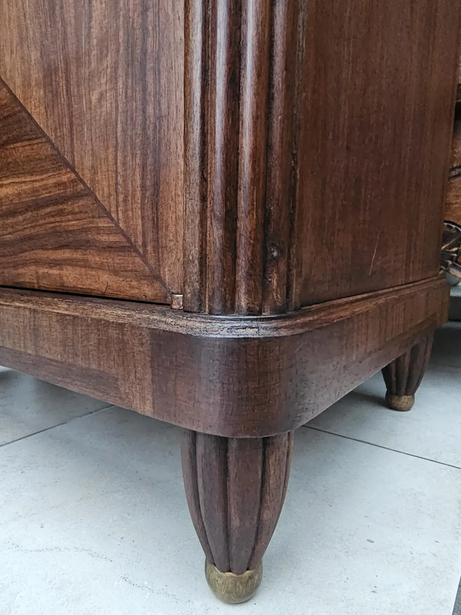 Art Deco bedside table with a green marble top.