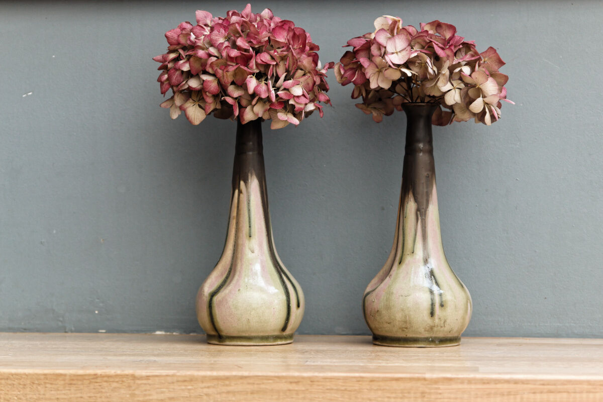 Pair of glazed sizzlings, signed