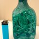 White multi-layer blown glass bottle vase with blue and green inclusions