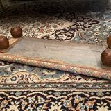 Long rustic footrest on ball feet