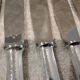 12 silver-plated table knives by Christofle America, 24.5cm