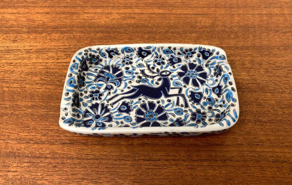 Vintage handmade blue ceramic ashtray with deer and flower ornament from Rodos Ceramics.