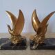 Pair of golden bird bookends on veined marble – Mid-Century vintage
